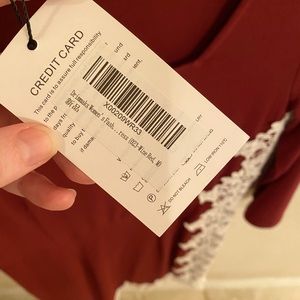 Wine color above knee bias cut hem with lace detail, size M.